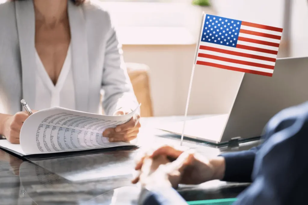 USCIS immigration officer reviewing documents during a green card interview